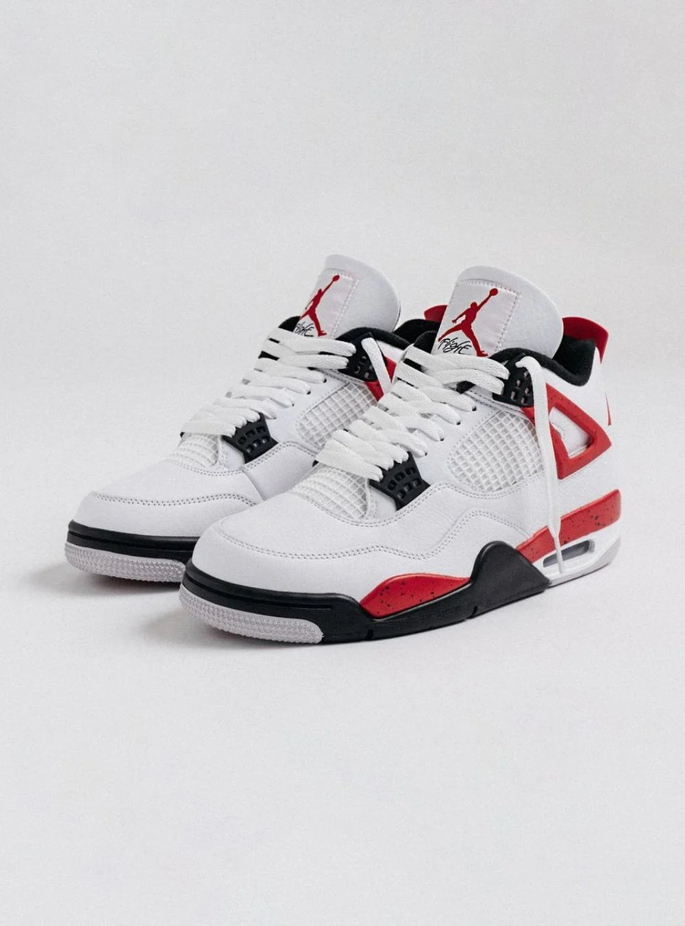 Air Jordan 4 Red Cement vista diagonale sinistra