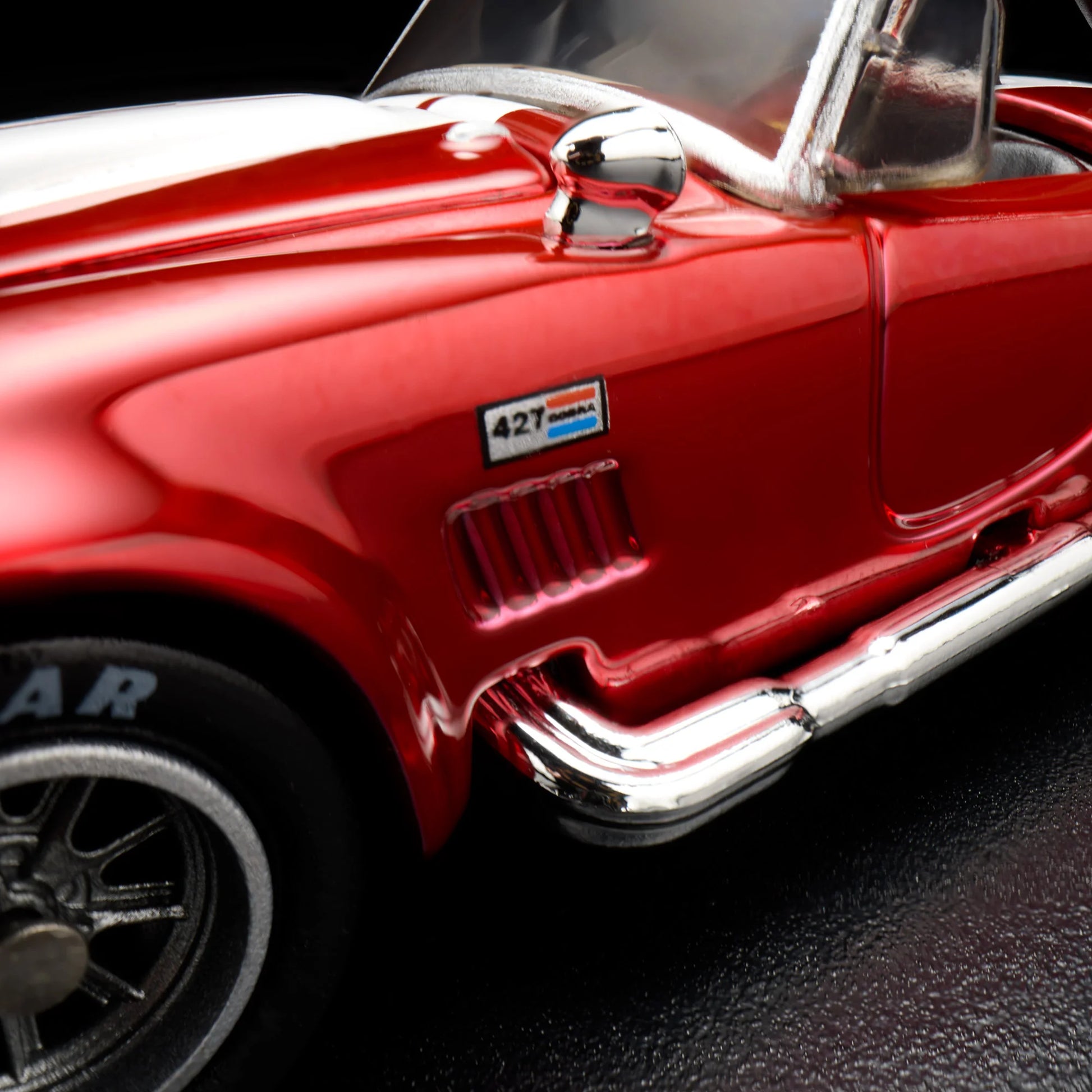 Close-up of the sise of the Hot Wheels 1965 Shelby Cobra 427 S/C RLC model
